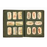 A vintage cigarette card album, with sets and part sets of cards, Players, Wills etc.