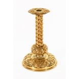 A 19th century Dutch embossed brass candlestick. Height 30 cm.