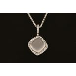 An 18 ct white gold pendant on chain, set with a cabochon rose quartz with diamond set halo.