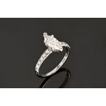 A 14 ct white gold diamond engagement ring, the marquise centre diamond 1.