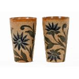 A pair of Royal Doulton Lambeth beakers, with incised floral design,