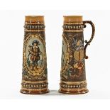 A large pair of Mettlach jugs, stamped with various marks and also 1562. Height 47 cm.