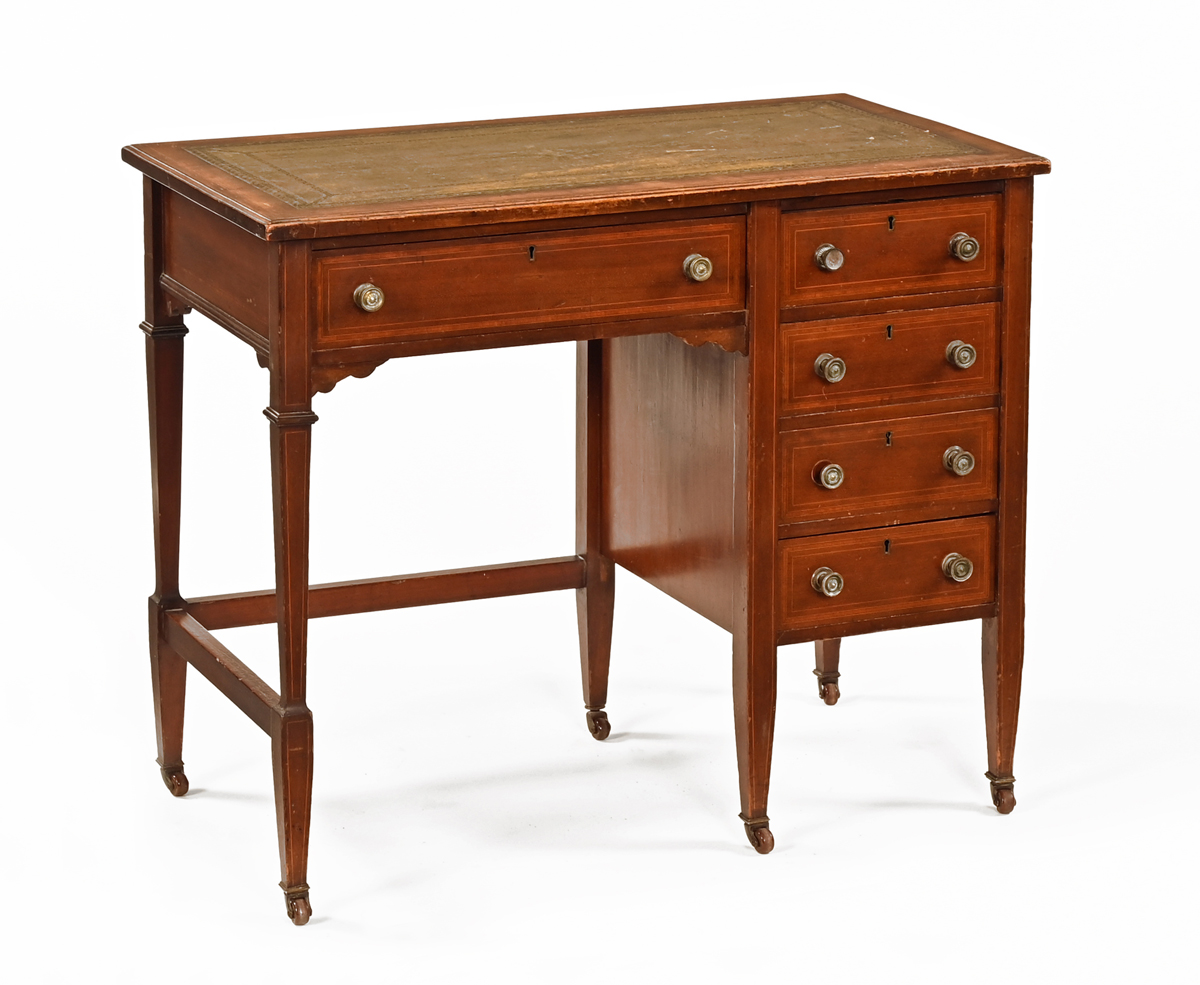 An Edwardian inlaid mahogany kneehole desk, with tooled leather writing surface,