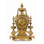 An early 20th century continental brass mantle clock, in the Neo-Classical style. Height 40 cm.