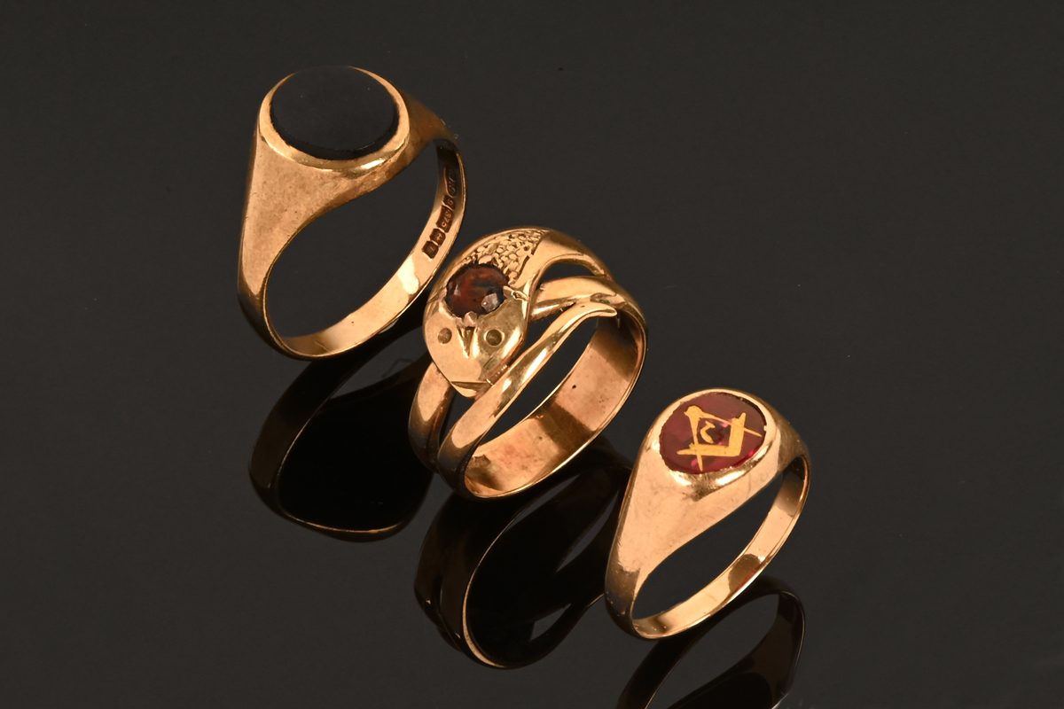 A 9 ct gold garnet snake set ring, size S, 5.7 grams, a Masonic ring stamped 10 k , size S, 4.