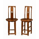 A pair of Chinese hall chairs, with splat back shaped seats and moulded legs.