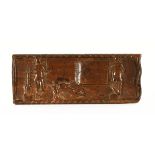 An African carved wooden plaque, depicting figures. 15 cm x 39 cm.