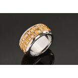 An 18 ct gold and steel puzzle ring, set with diamonds weighing +/- 1.44 carats. Size K.