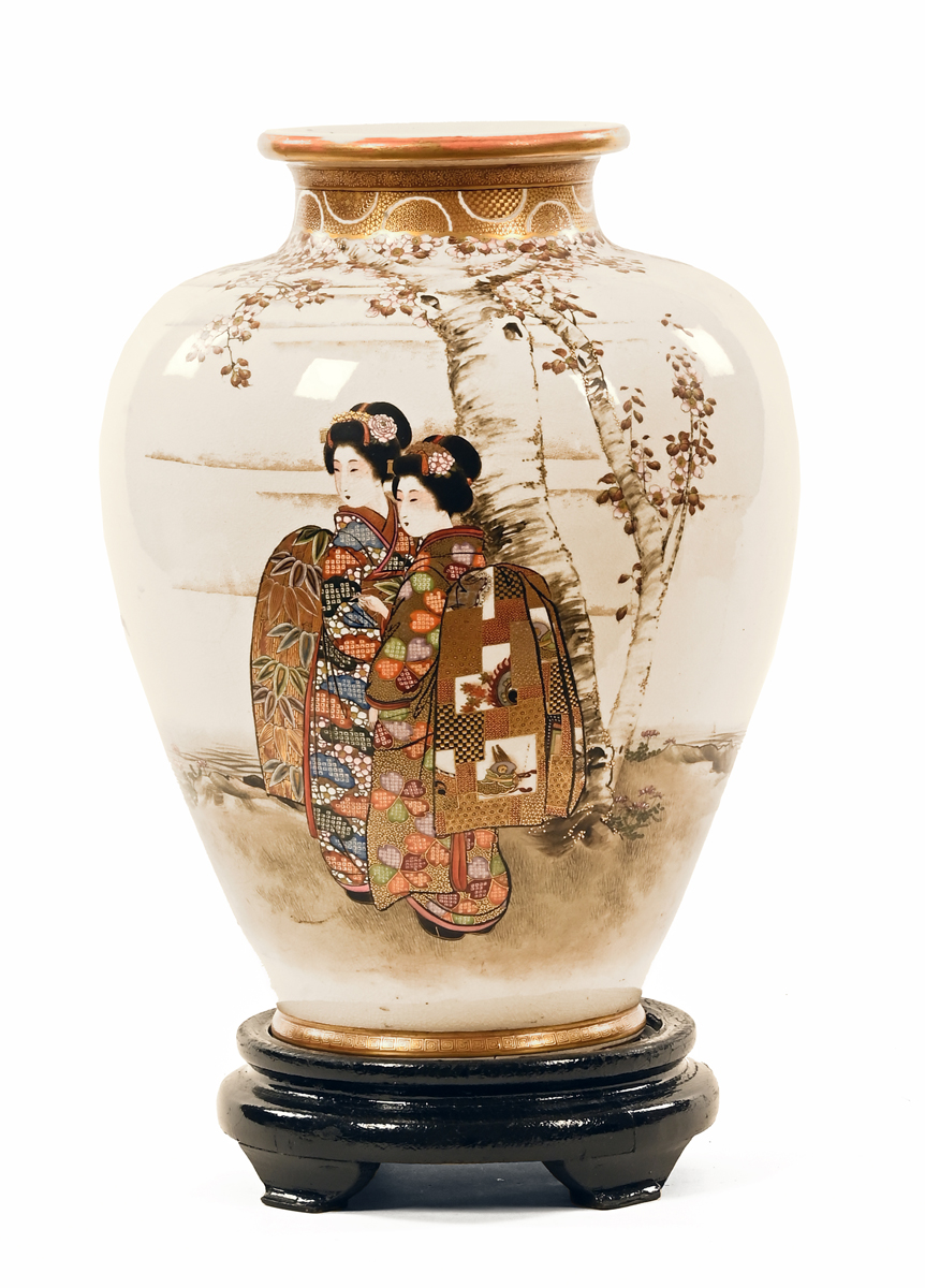 A large Japanese Meiji period Satsuma vase, decorated with figures and heightened with gilding,