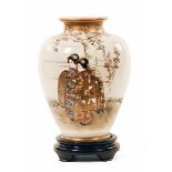 A large Japanese Meiji period Satsuma vase, decorated with figures and heightened with gilding,