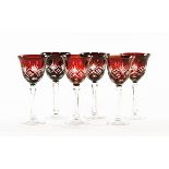 A set of six cranberry and cut glass hock glasses. Height 20 cm.