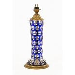 An early 20th century Bohemian blue glass and brass faceted table lamp.