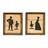 A pair of 19th century silhouette pictures, adults and children. 24.5 cm x 20 cm in gilt frames.