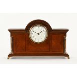 An Edwardian inlaid mahogany mantle clock, with single train movement. Case width 31 cm.