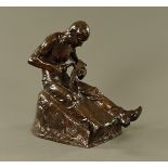 A Pohl bronze figure of a seated blacksmith fashioning a scythe blade. Height 50 cm.