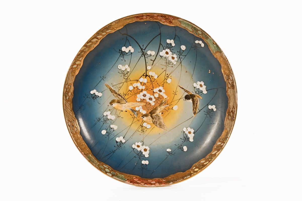 A 20th century Japanese Satsuma charger, with gilt floral and bird decoration. 29 cm diameter.