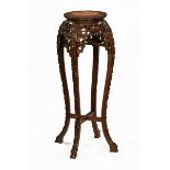 A Chinese hardwood rouge marble topped jardiniere stand.