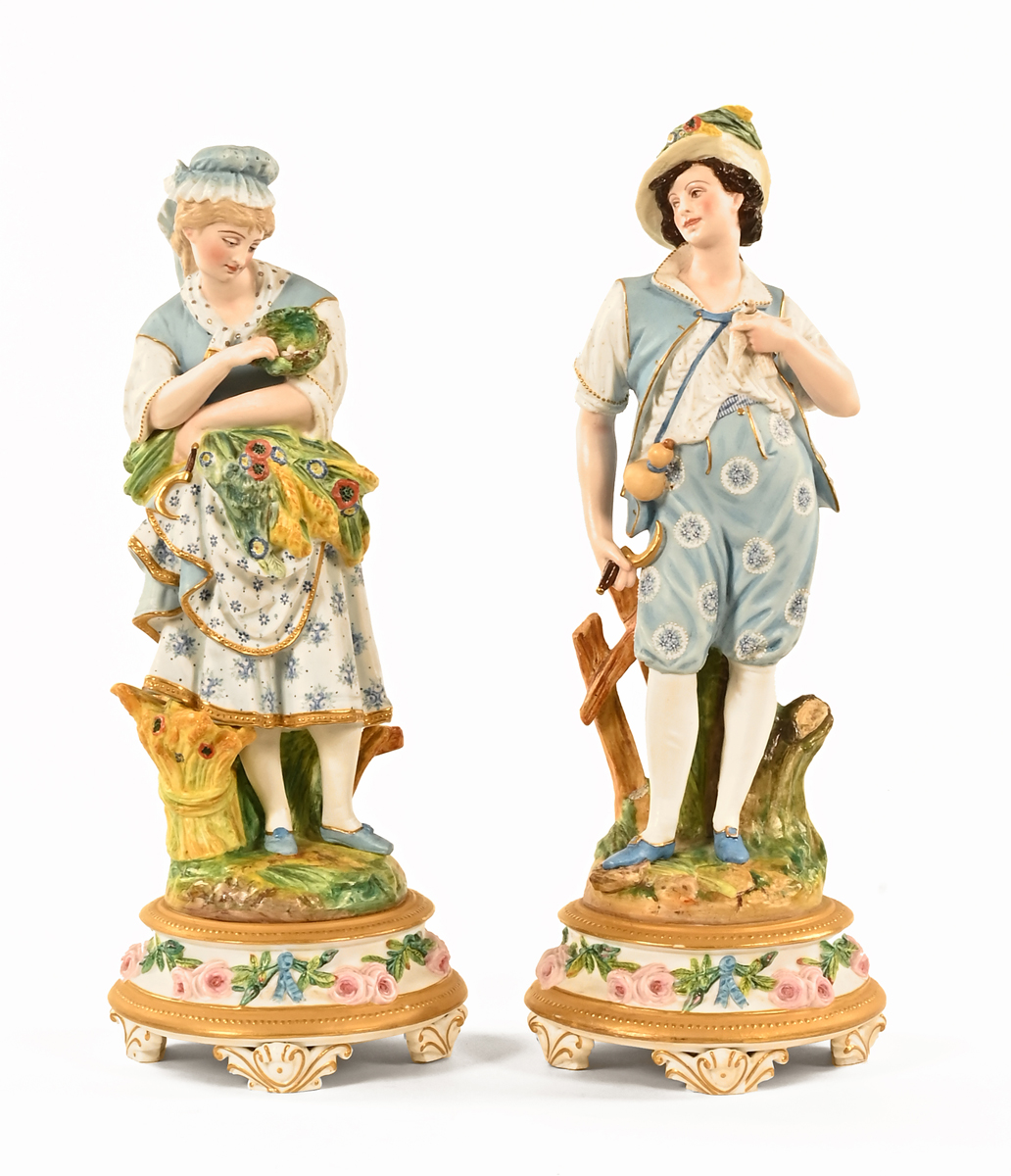 A pair of continental bisque porcelain harvesting figures, polychrome, impressed ML. Height 43 cm.