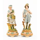 A pair of continental bisque porcelain harvesting figures, polychrome, impressed ML. Height 43 cm.