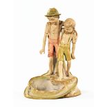 A Royal Dux style Austrian figure, two boys by pool with lizard,