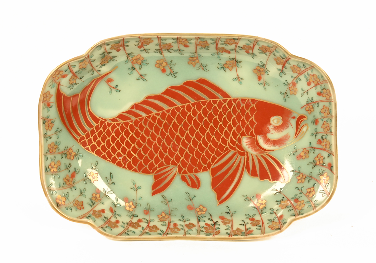 A Japanese porcelain shaped dish, decorated with a fish. Length 24 cm.