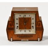 An Art Deco walnut cased Westminster chime three train mantle clock.