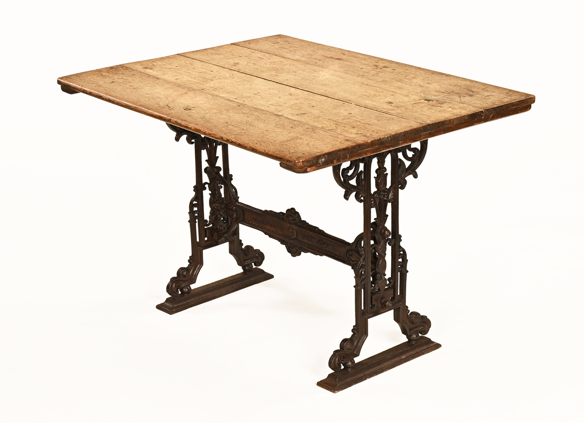 A Victorian cast iron table base by Parnall & Sons Bristol, with oak top.