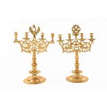 A pair of 19th century Dutch brass four branch candelabra, with circular stepped bases.