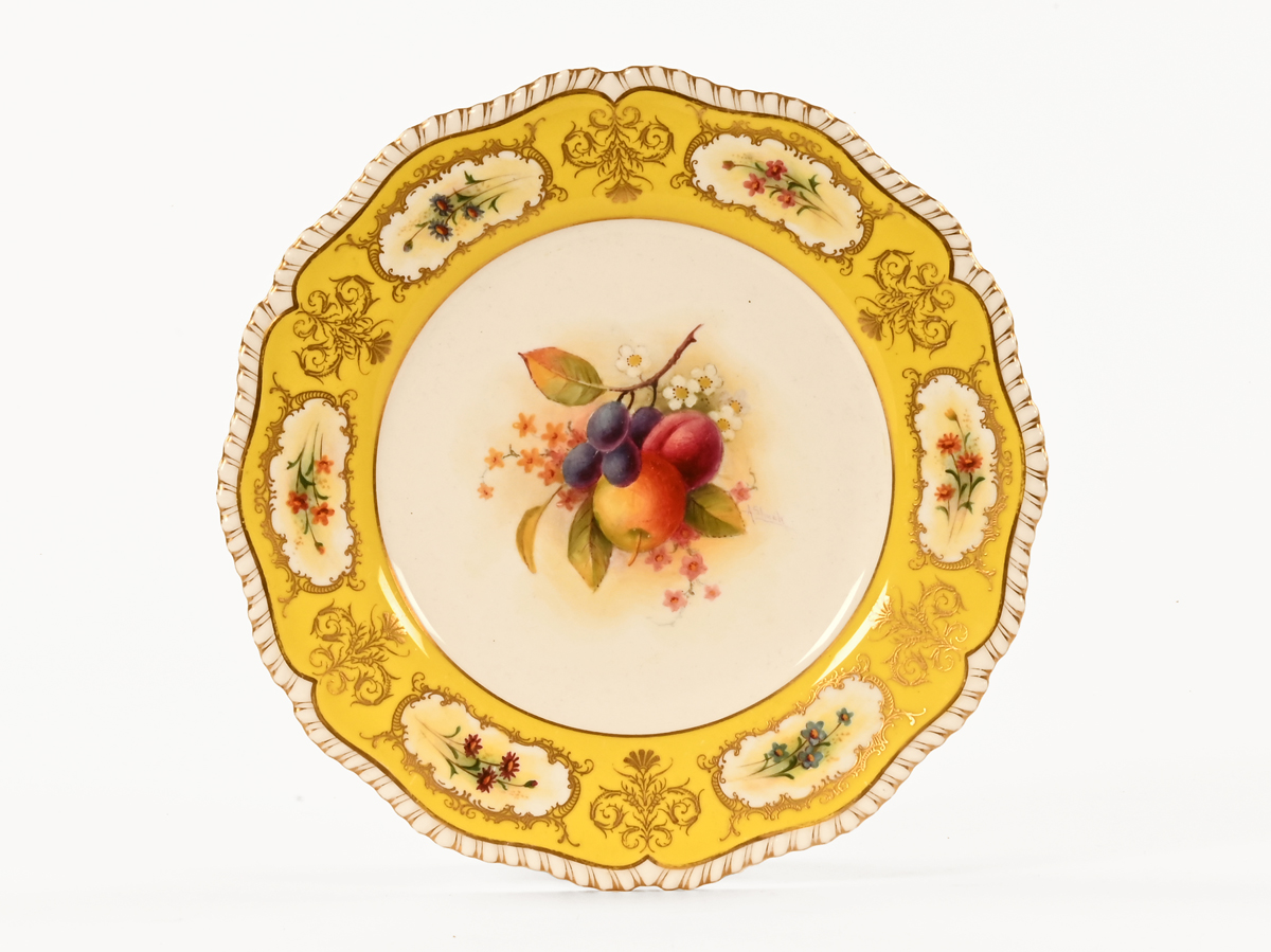 A Royal Worcester plate, painted by Albert Shuck with fruit,