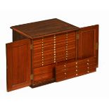 An early 19th century rosewood table top coin cabinet,