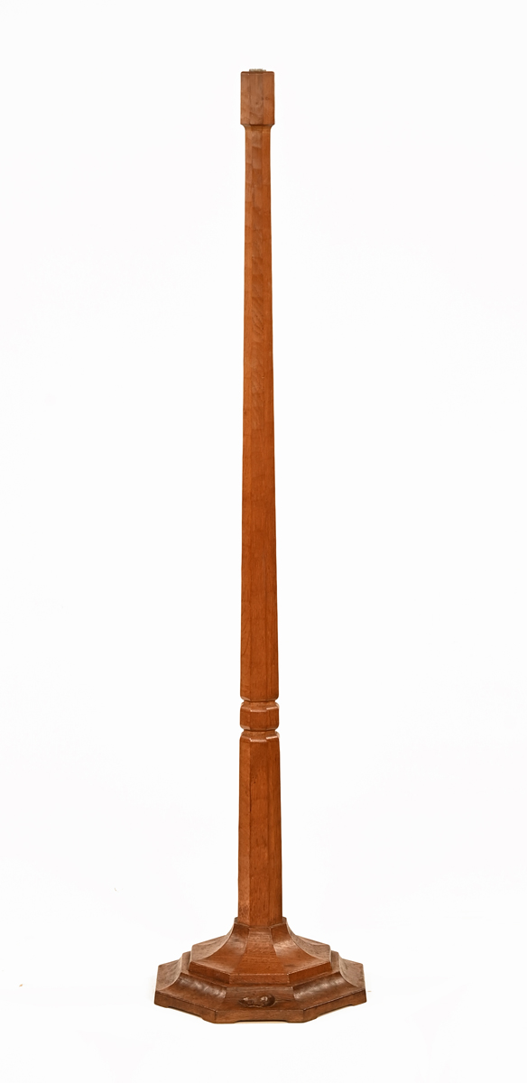 A Mouseman Thompson of Kilburn lamp standard, with faceted column and stepped octagonal base.