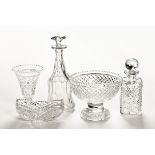 A cut glass fruit bowl, two decanters, vase and bowl.