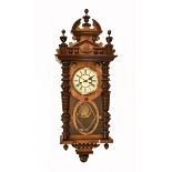 A Victorian walnut single weight eight day regulator Vienna style wall clock. 104 cm high.
