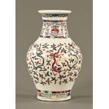 A 19th century Chinese vase, all over decorated with dragons and repeating designs,