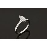 An 18 ct white gold solitaire ring, set with a marquise cut diamond weighing +/- 1.02 carats.