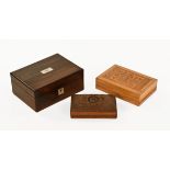 A 19th century rosewood sewing box, together with two other carved boxes. Largest width 27 cm.