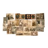 Three cased Victorian photographs, another and a collection of unmounted photographs.