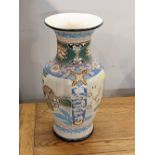 Oriental ceramic vase decorated with buildings and flowers,