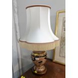 Floral gilt table lamp with tasselled shade