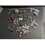 Box of costume jewellery to include a floral set brooch,