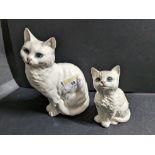 Two Beswick white cat ornaments, stamped 1030 and 1886,