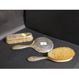 Three piece silver hallmark dressing table set (two brushes and circular mirror)