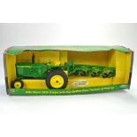 Ertl 1/16 Model Farm Issue comprising John Deere 3020 Tractor with Four Bottom Plow. Appears