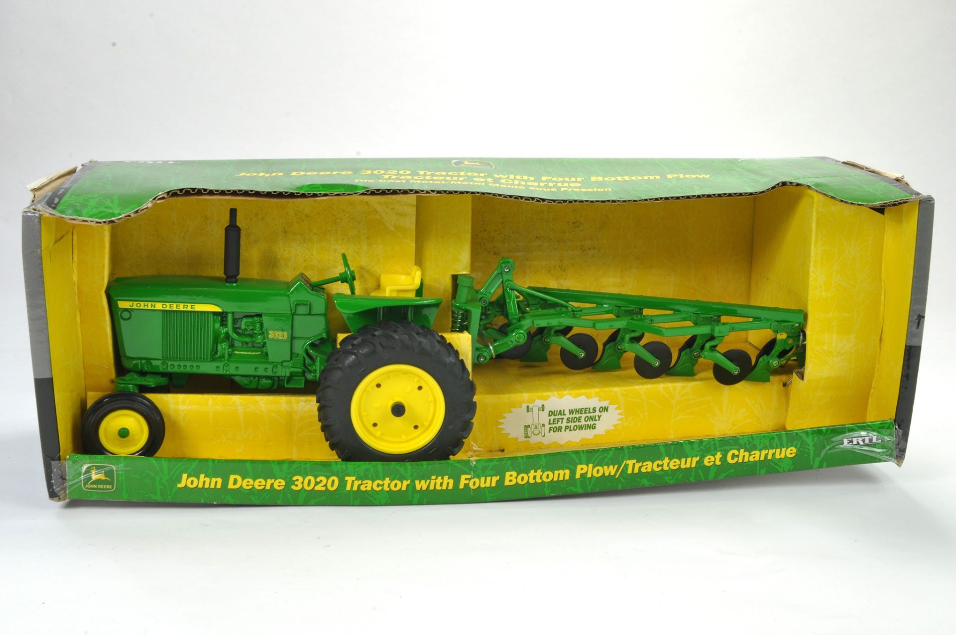 Ertl 1/16 Model Farm Issue comprising John Deere 3020 Tractor with Four Bottom Plow. Appears