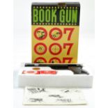 James Bond 007 Book Gun, from Japan comprising Plastic Gun, target and pellets, looks complete,