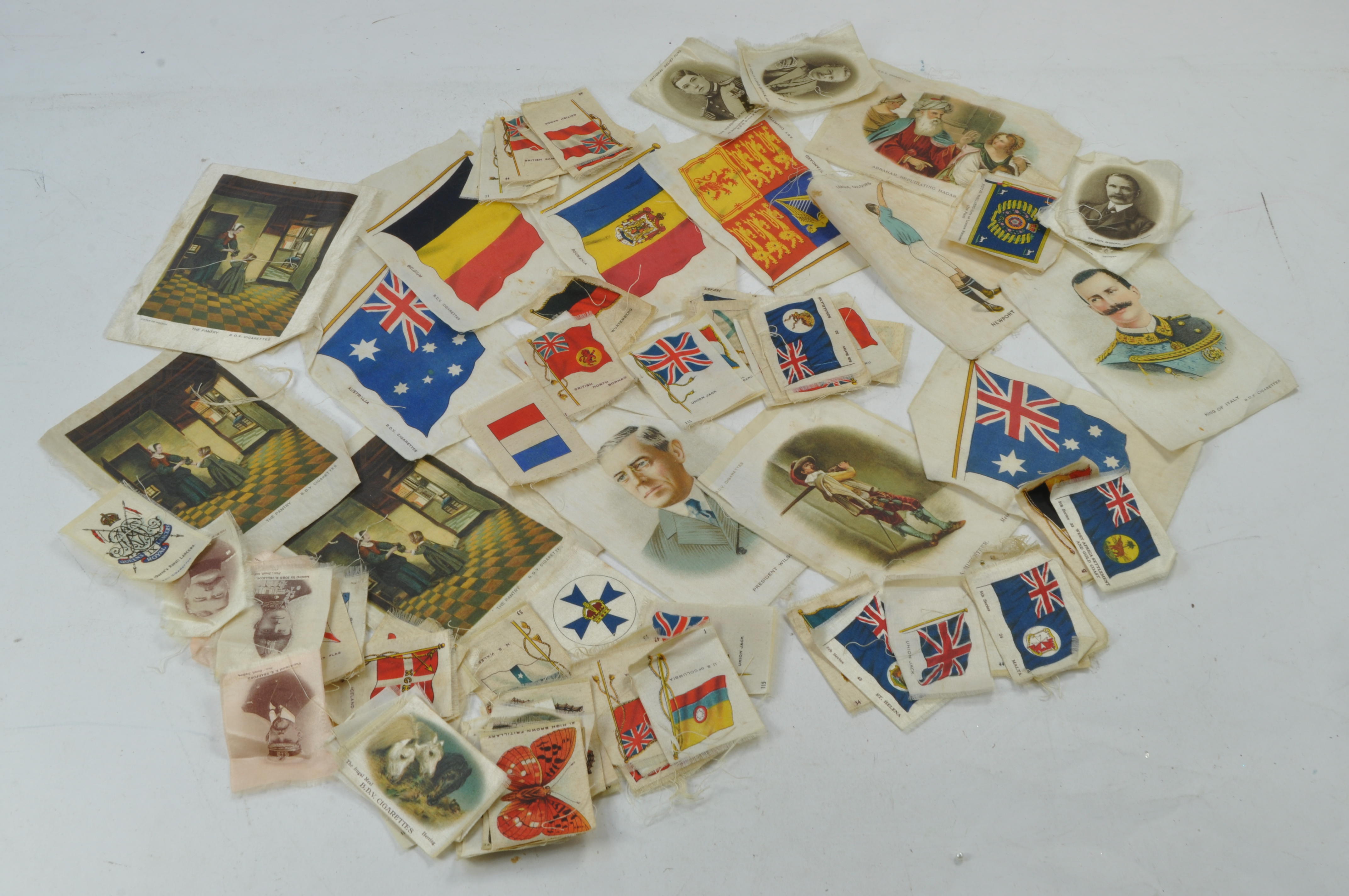 A group of WWI BDV Cigarettes original silks.(Approx.90) Various sizes slight fraying to edges, plus