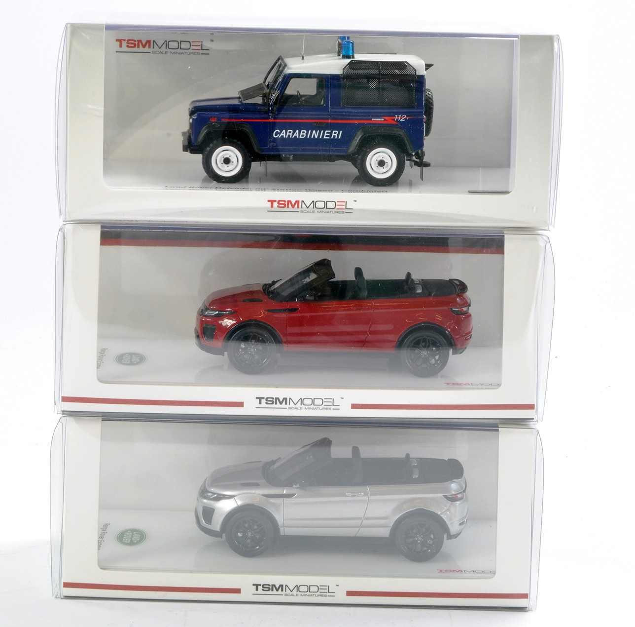 TSM Models 1/43 trio comprising Land Rover Defender and duo of Land Rover Evoque issues. Not