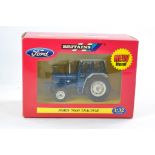 Britains Farm 1/32 issue comprising Ford 7000 Tractor, dark blue decals. Excellent with original