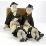 Laurel and Hardy group of four ceramic dressed figures, two different sizes as shown. Look to be