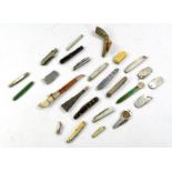 A diverse group of vintage pocket knives (and some letter openers) of various sizing and